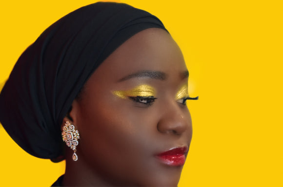 Model is wearing HELLO YELLOW Hi-Def Pigment on eyes, COPPER Hi-Def Pigment as highlight & FIERY Lip Gloss